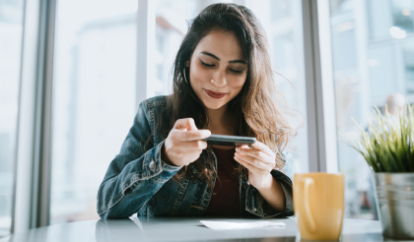 Woman taking photo of check